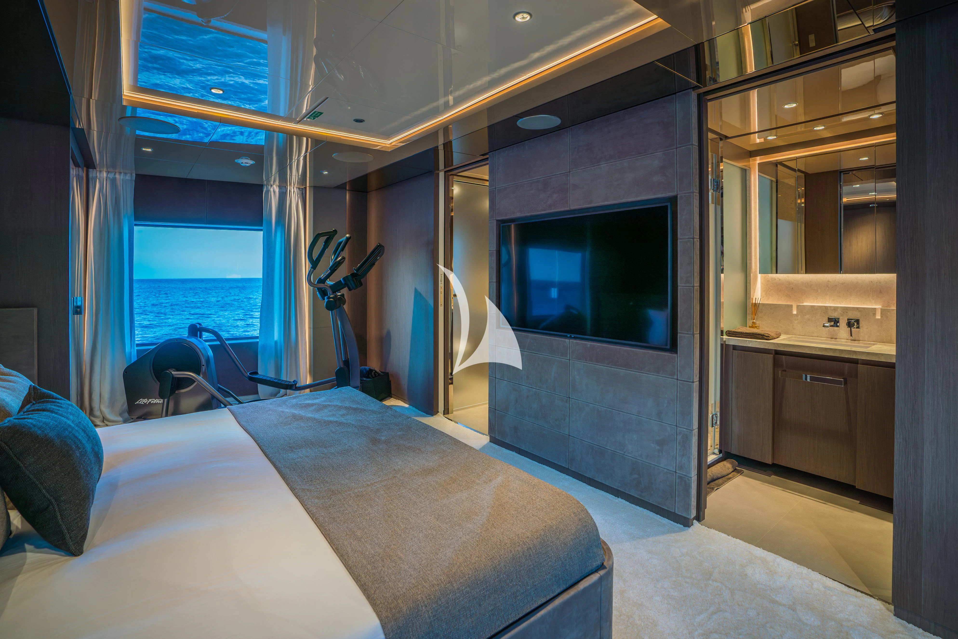 a room with a bed and a tv aboard ALVIUM Yacht for Sale