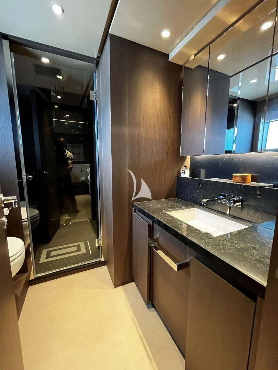 a bathroom with a large mirror aboard ALVIUM Yacht for Sale