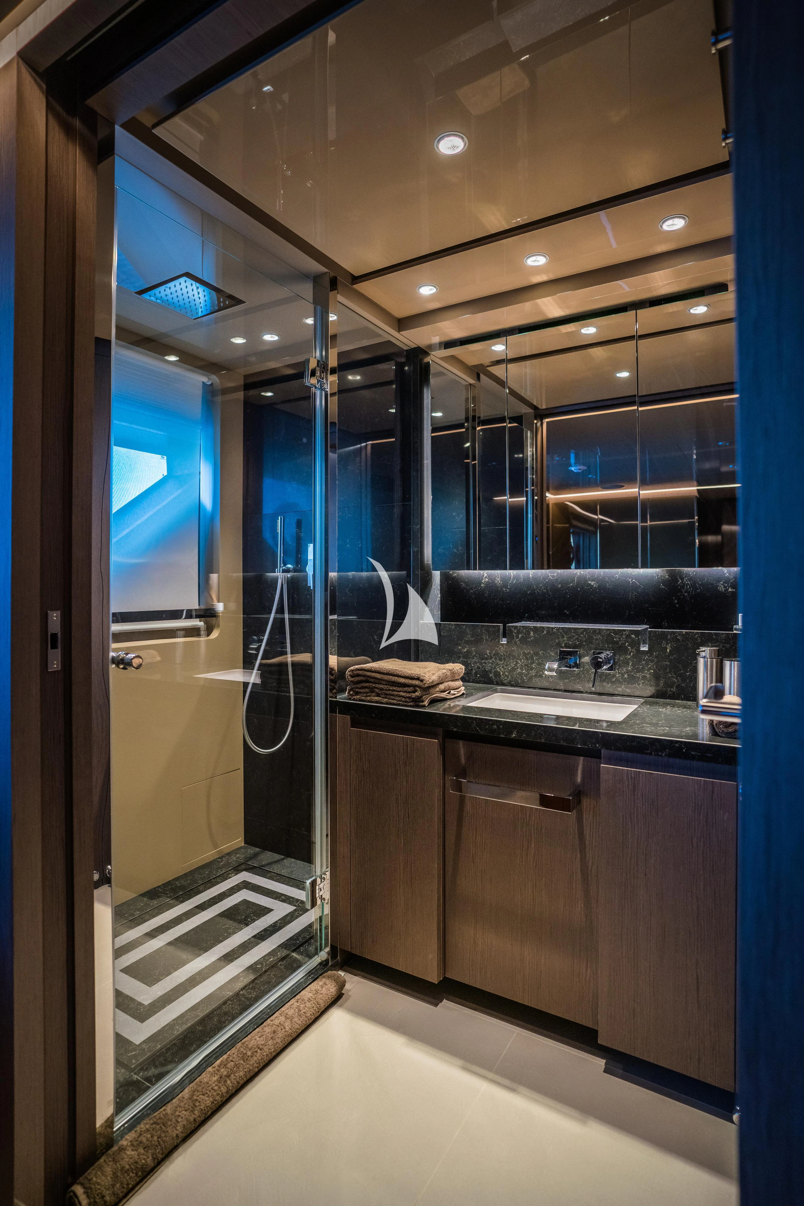 a bathroom with a glass shower aboard ALVIUM Yacht for Sale
