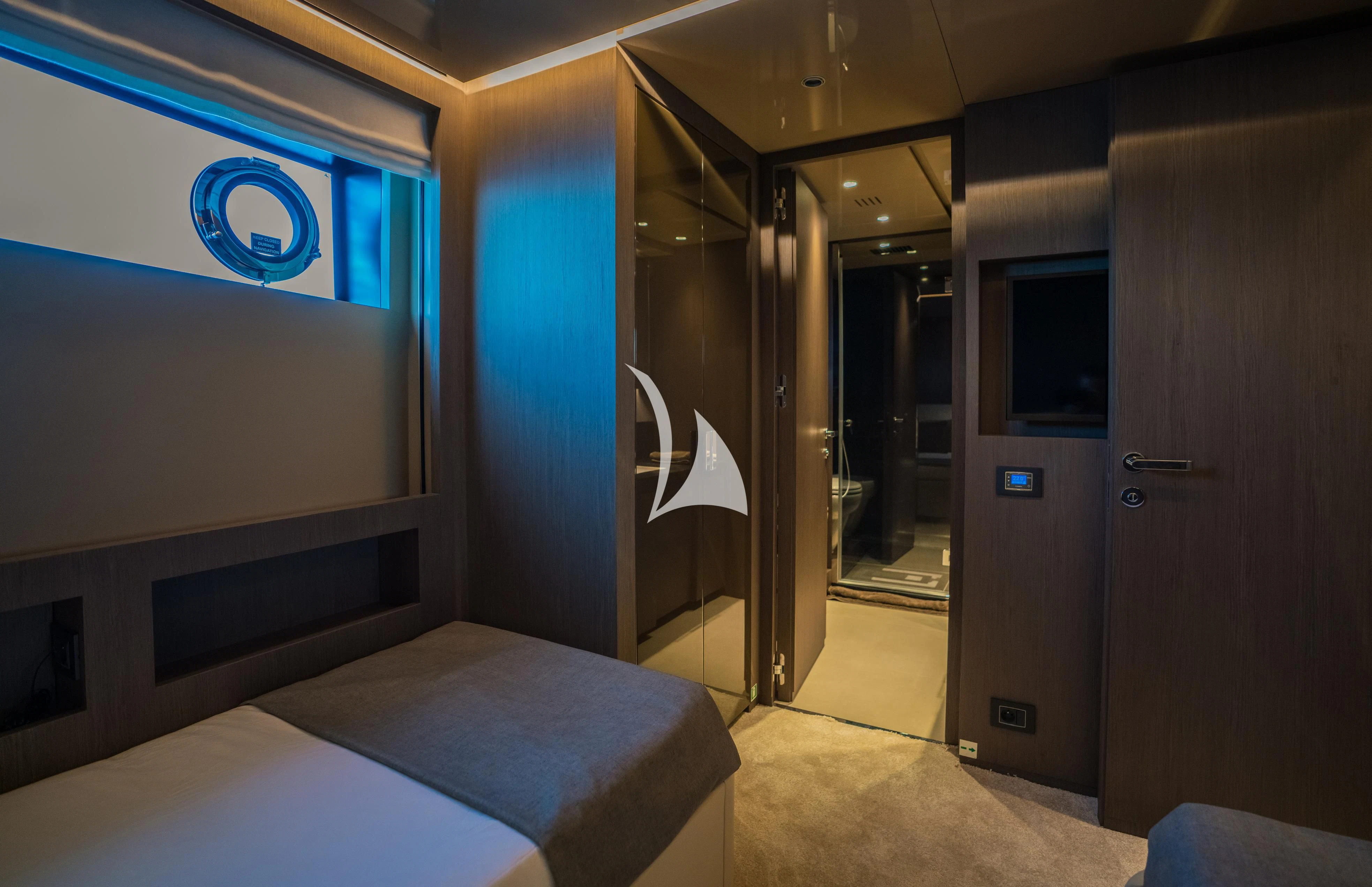 a room with a bed and a television aboard ALVIUM Yacht for Sale