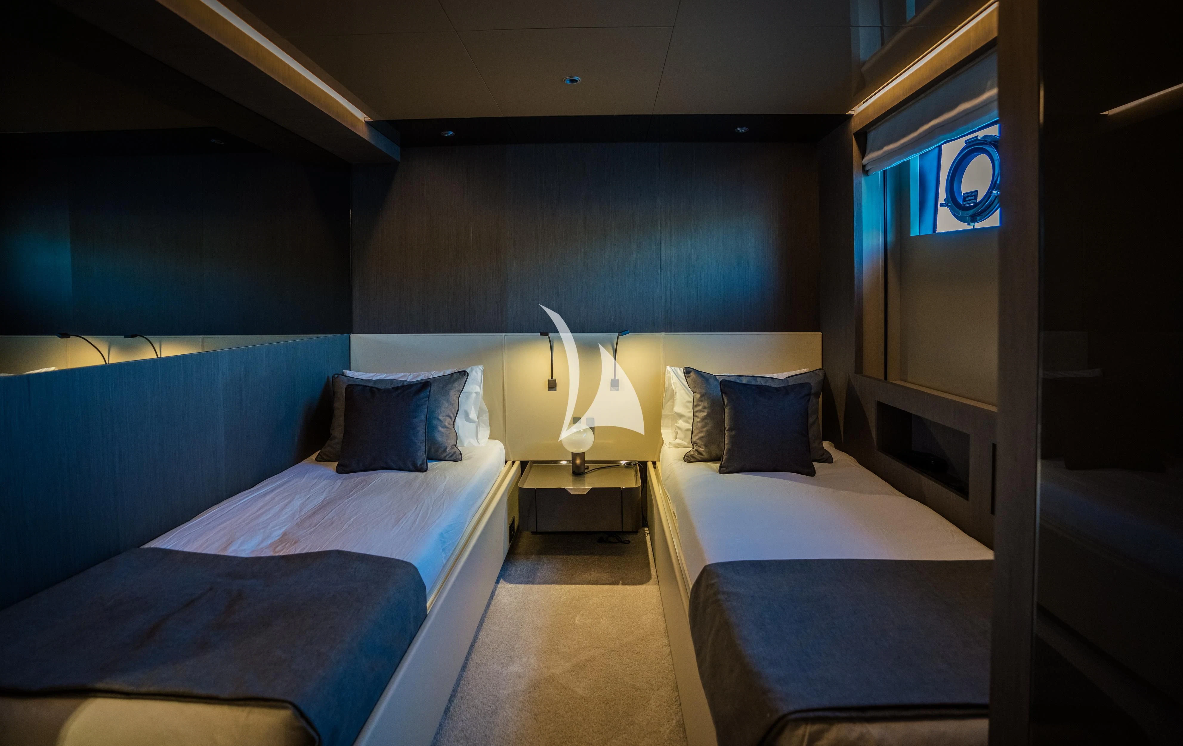 a room with beds and a window aboard ALVIUM Yacht for Sale
