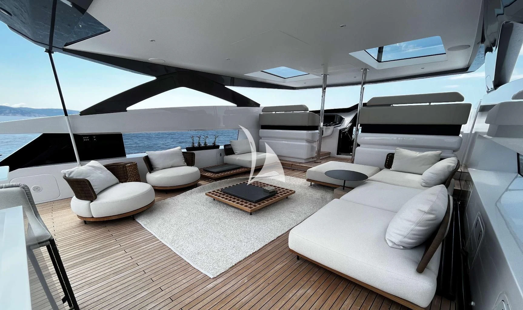 a large white yacht with a large white lounge chair and a table aboard ALVIUM Yacht for Sale
