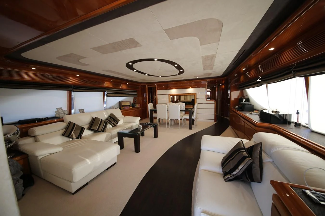 a large living room with a large open ceiling aboard YOLO TOO Yacht for Sale