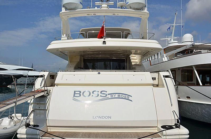 a white yacht with a red sail aboard YOLO TOO Yacht for Sale