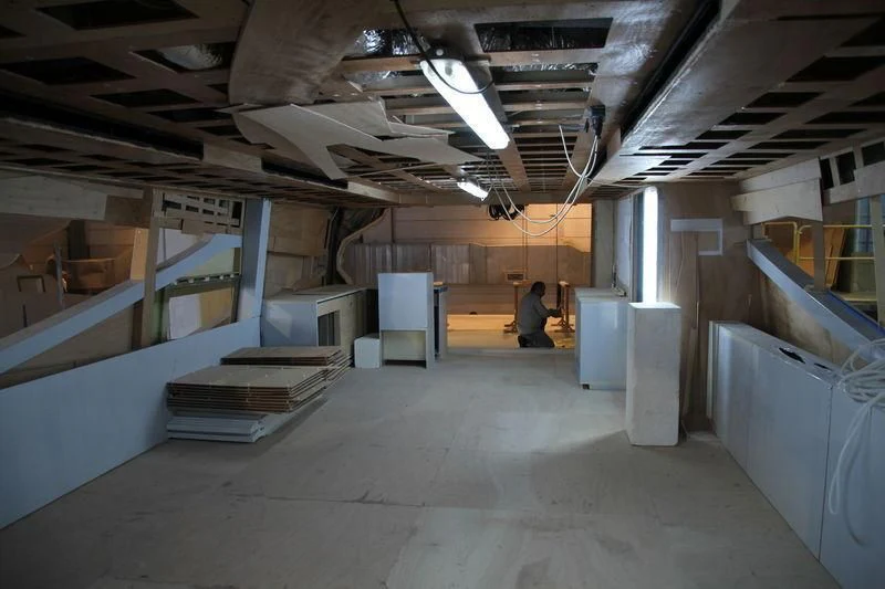 a person sitting in a warehouse aboard DOLCE VITA Yacht for Sale