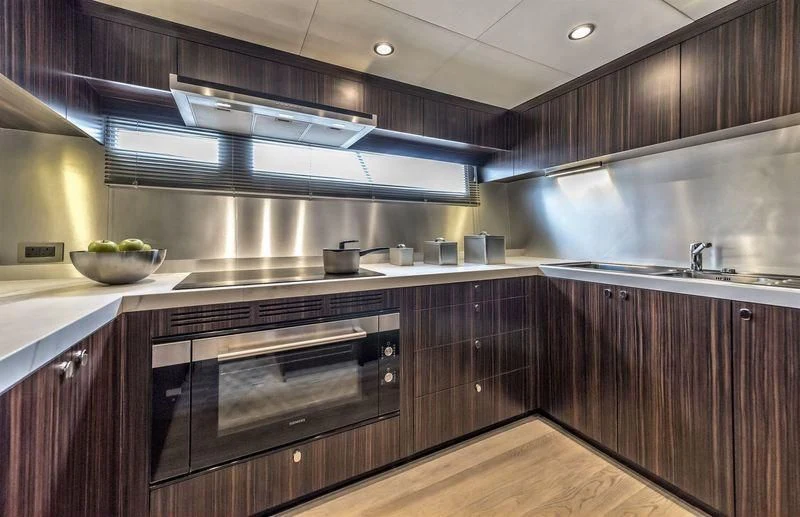 a kitchen with a stainless steel oven aboard DOLCE VITA Yacht for Sale