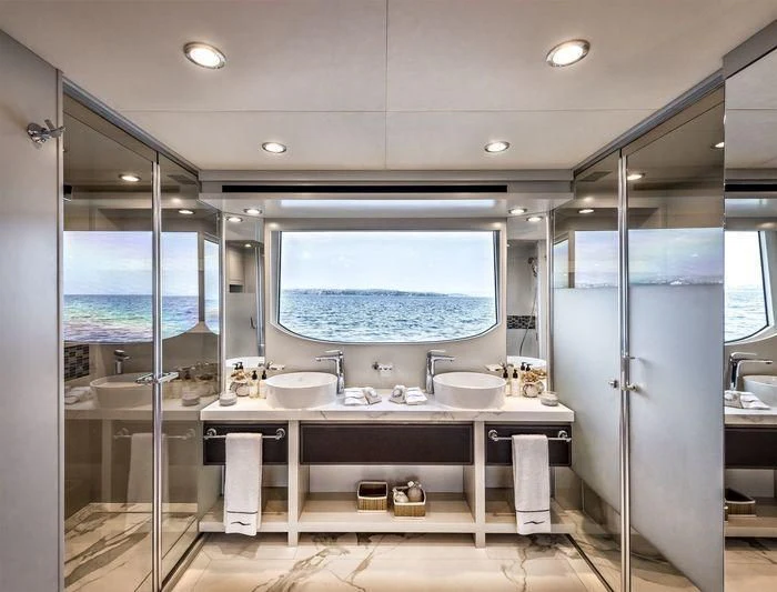 a bathroom with a large window aboard DOLCE VITA Yacht for Sale