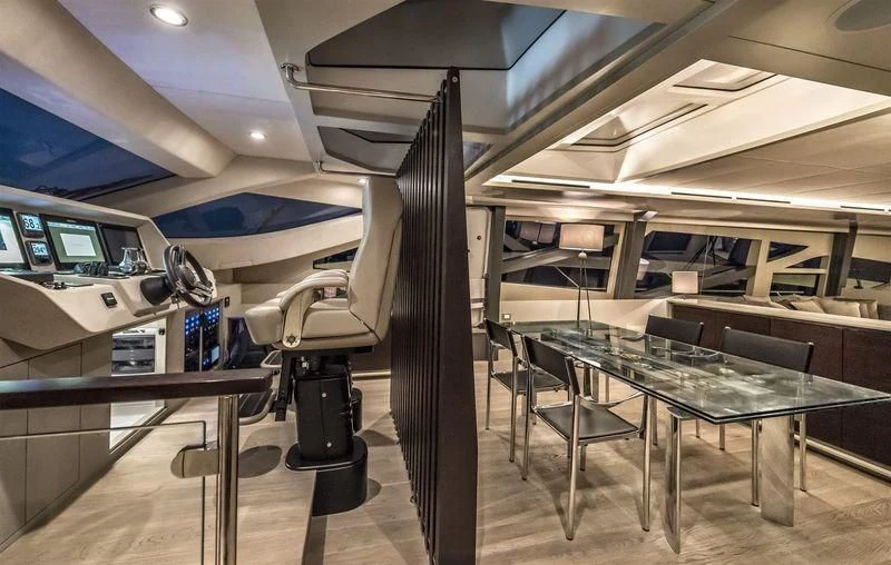 a room with tables and chairs aboard DOLCE VITA Yacht for Sale