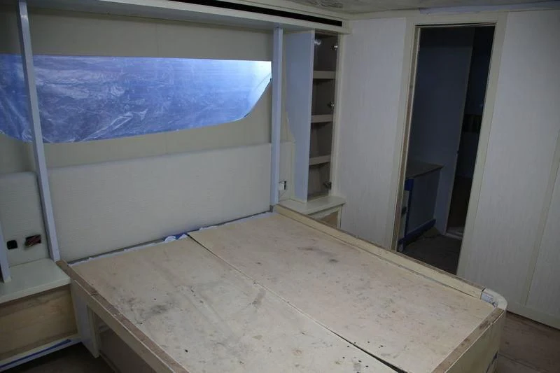 a room with a white wall and a white door aboard DOLCE VITA Yacht for Sale