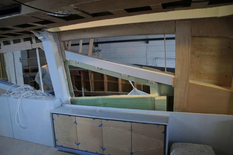 a room with a window and a ladder aboard DOLCE VITA Yacht for Sale