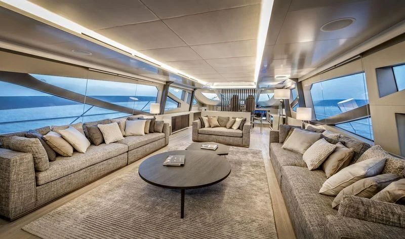 a living room with a couch and a tv aboard DOLCE VITA Yacht for Sale