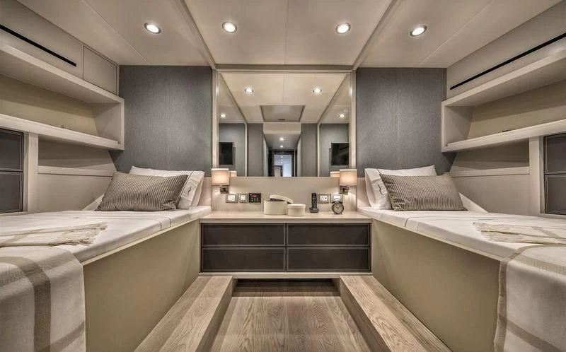 a room with a bed and a sink aboard DOLCE VITA Yacht for Sale