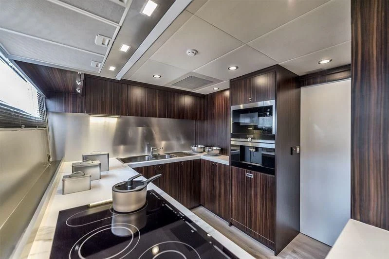 a kitchen with a large island aboard DOLCE VITA Yacht for Sale