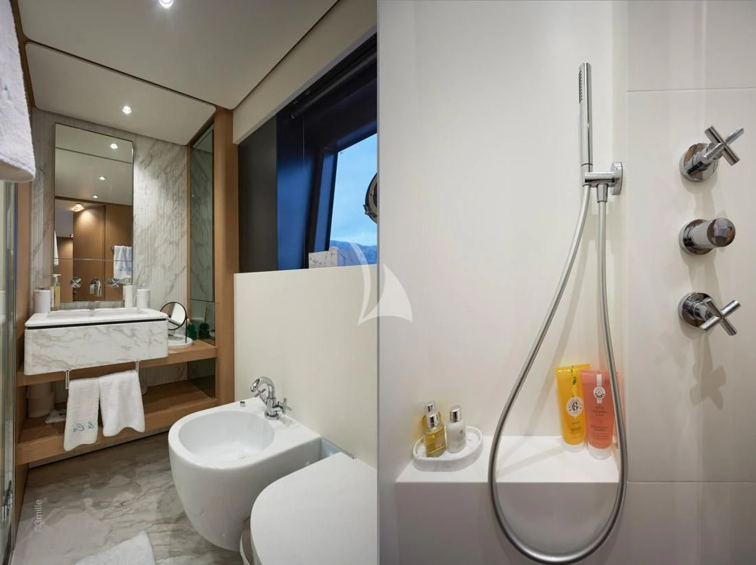 a bathroom with a shower and sink aboard H&CO Yacht for Sale