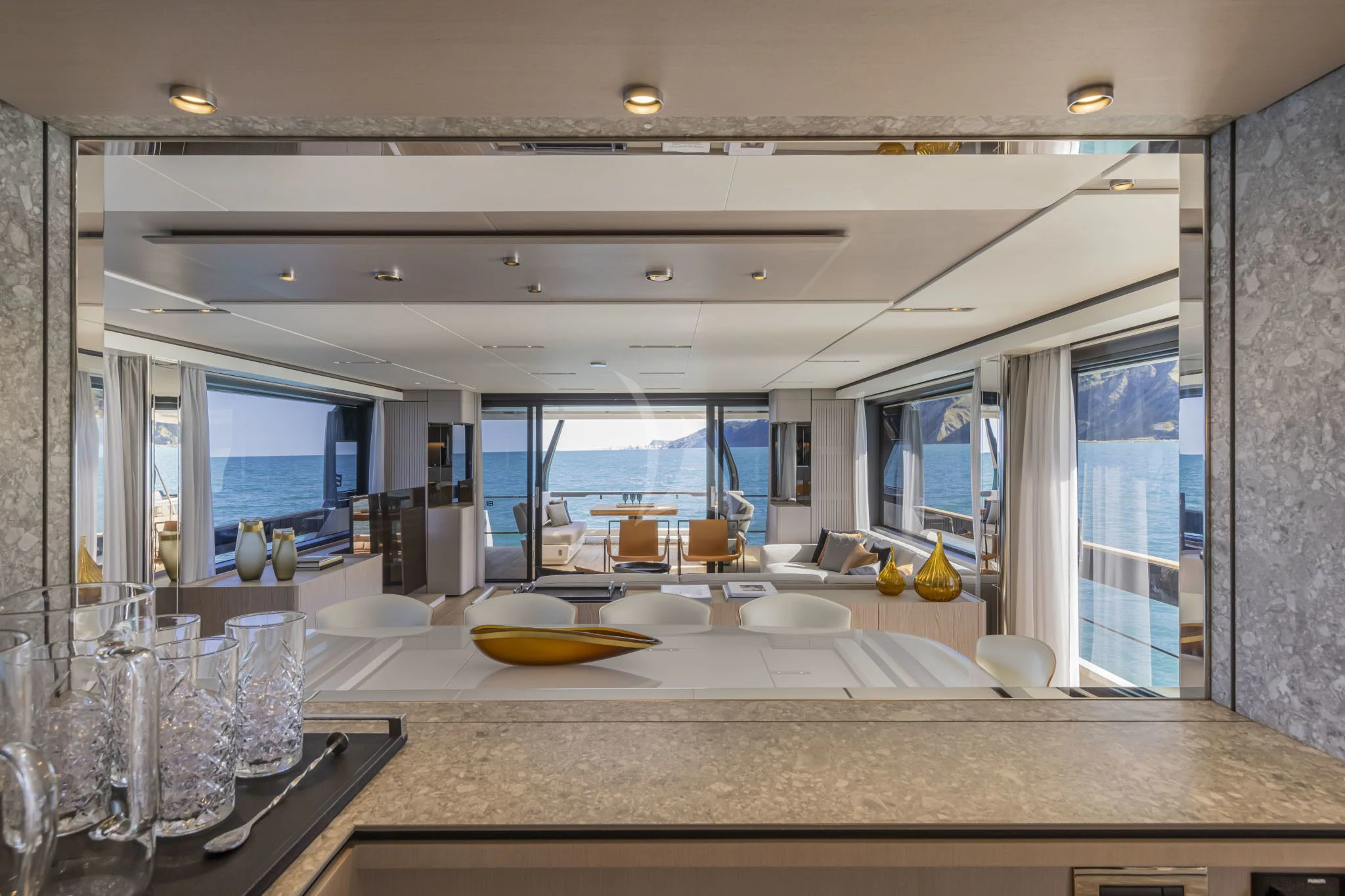 a large kitchen with glass walls aboard H&CO Yacht for Sale