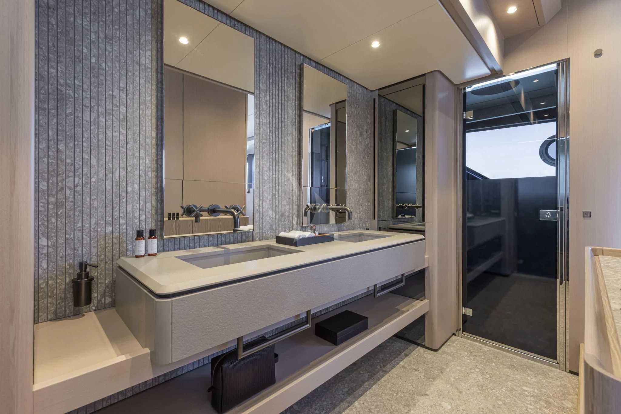 a bathroom with a large mirror aboard H&CO Yacht for Sale