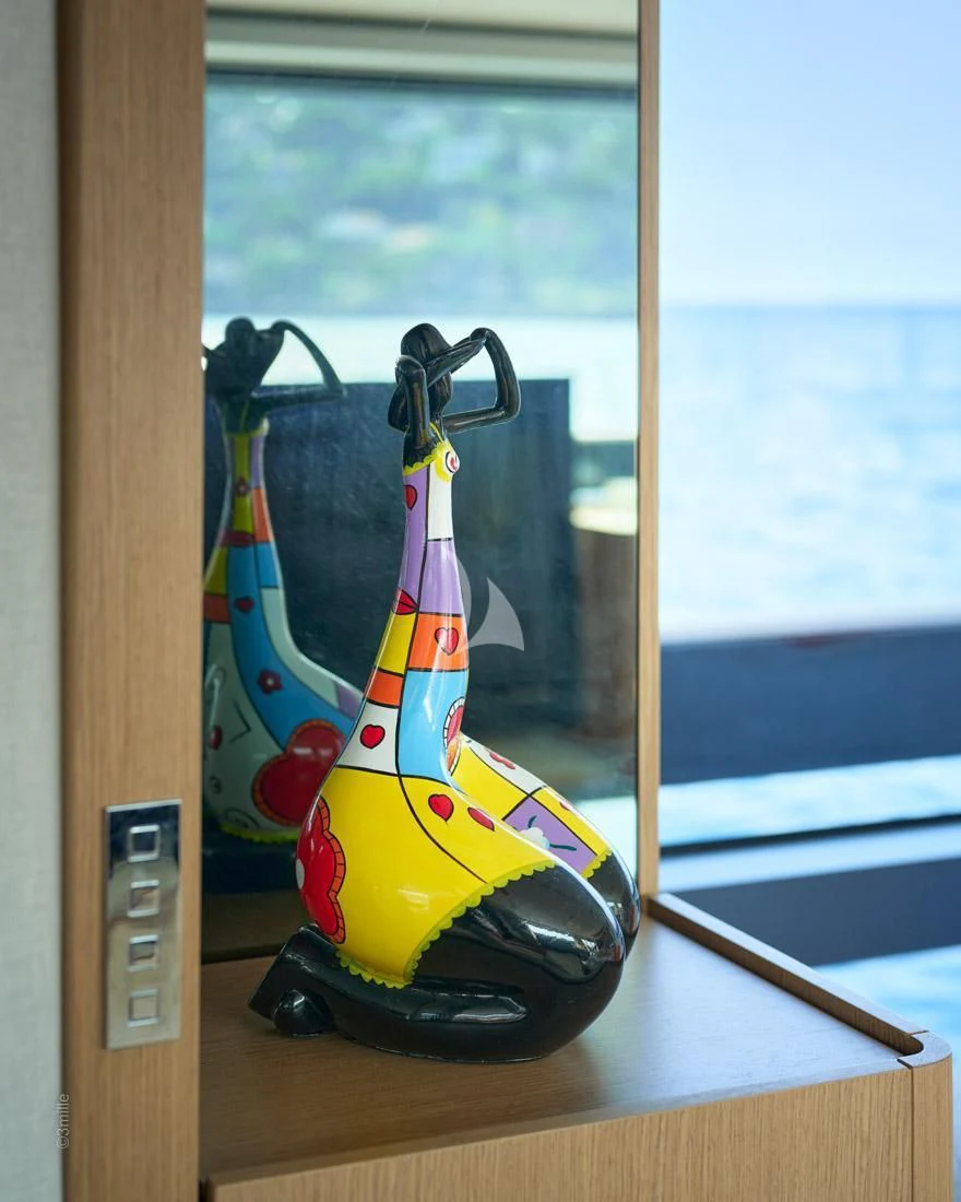 a colorful toy on a window sill aboard H&CO Yacht for Sale