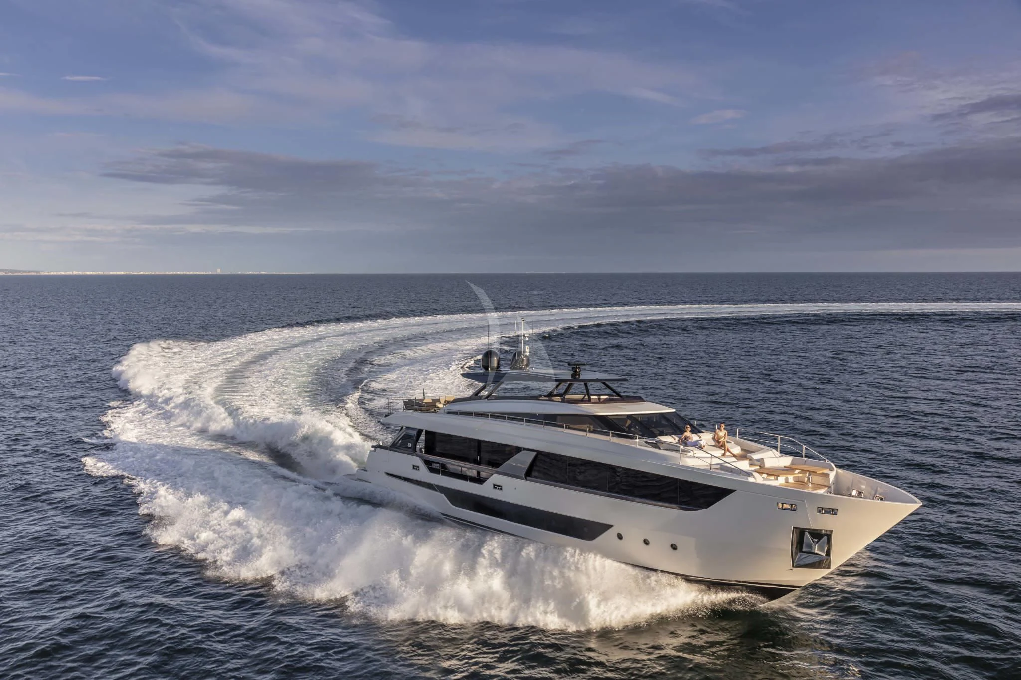 a white boat on the water aboard H&CO Yacht for Sale