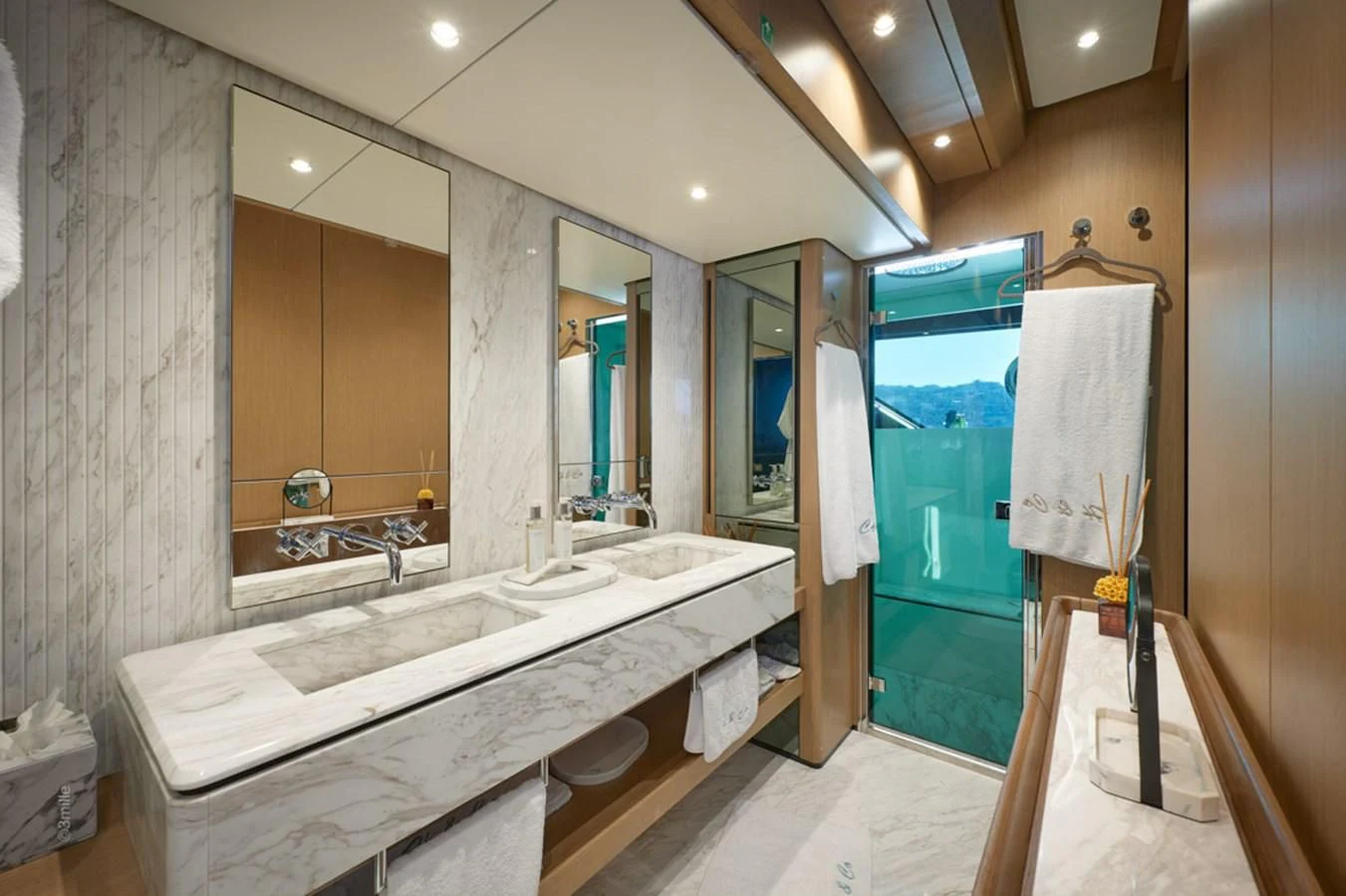 a bathroom with a large mirror aboard H&CO Yacht for Sale