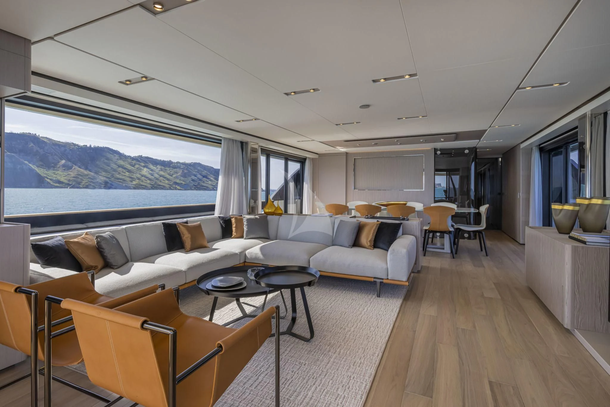 a living room with a large window aboard H&CO Yacht for Sale