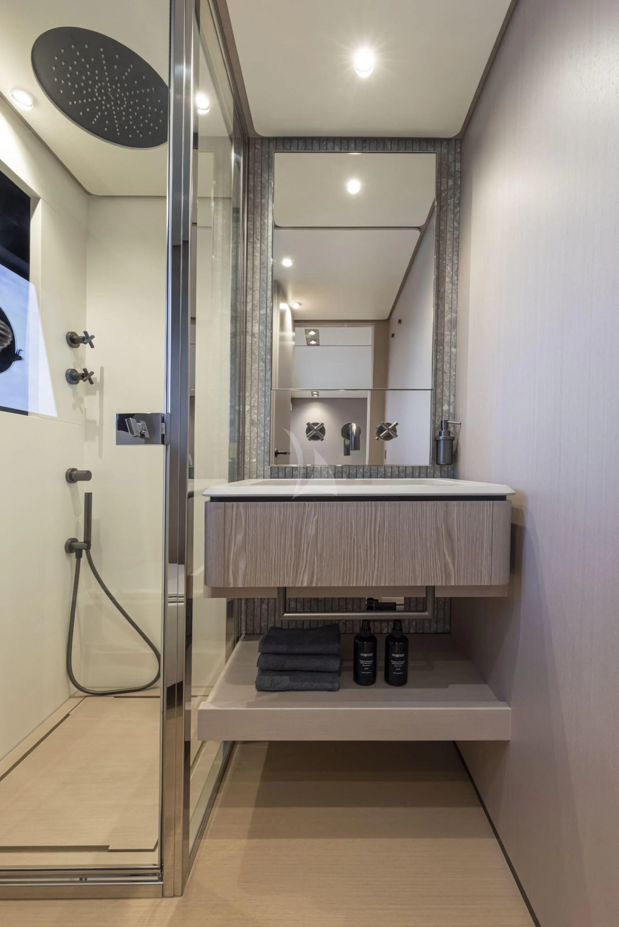 a bathroom with a sink and a mirror aboard H&CO Yacht for Sale