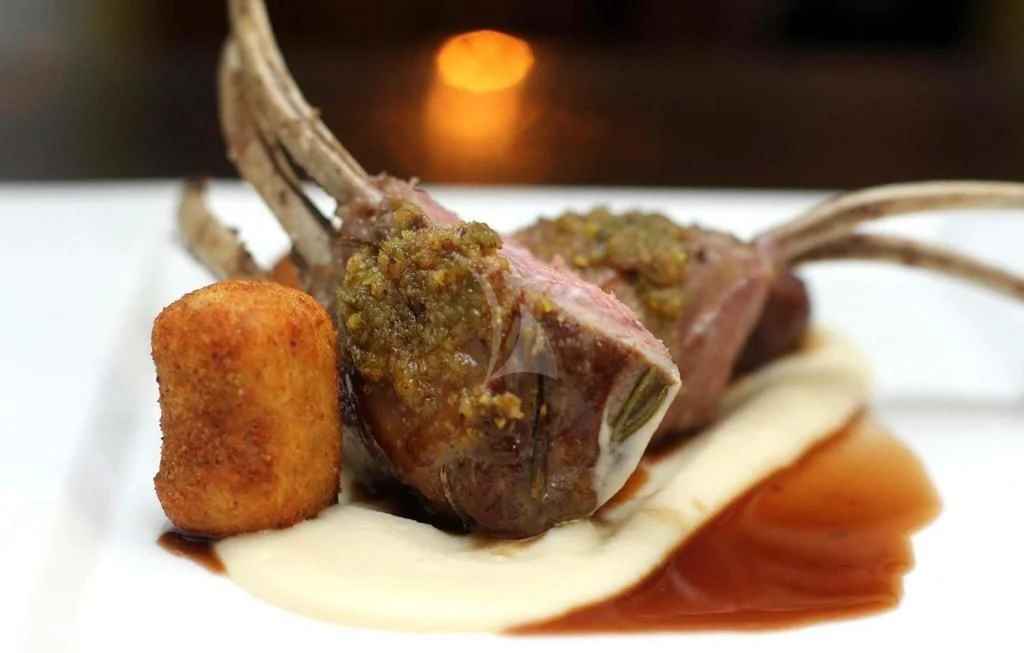 a close-up of a fork and a piece of meat aboard H&CO Yacht for Sale