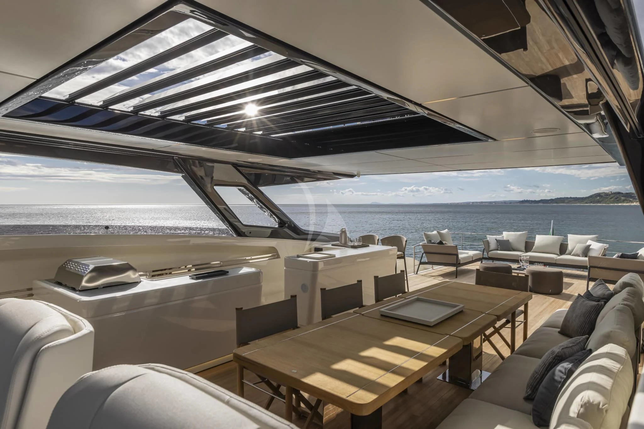 a room with a table and chairs aboard H&CO Yacht for Sale