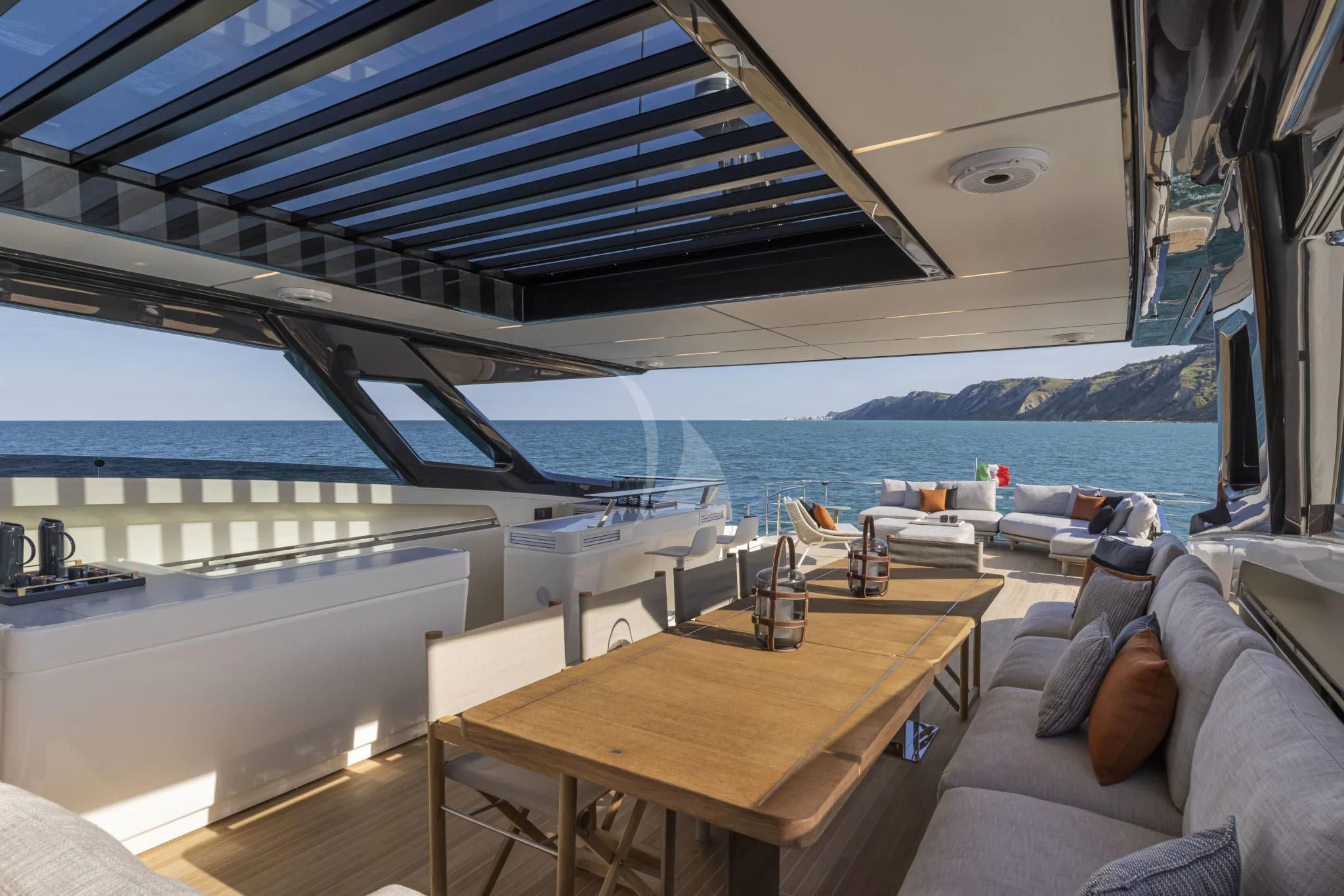 a room with a table and chairs aboard H&CO Yacht for Sale