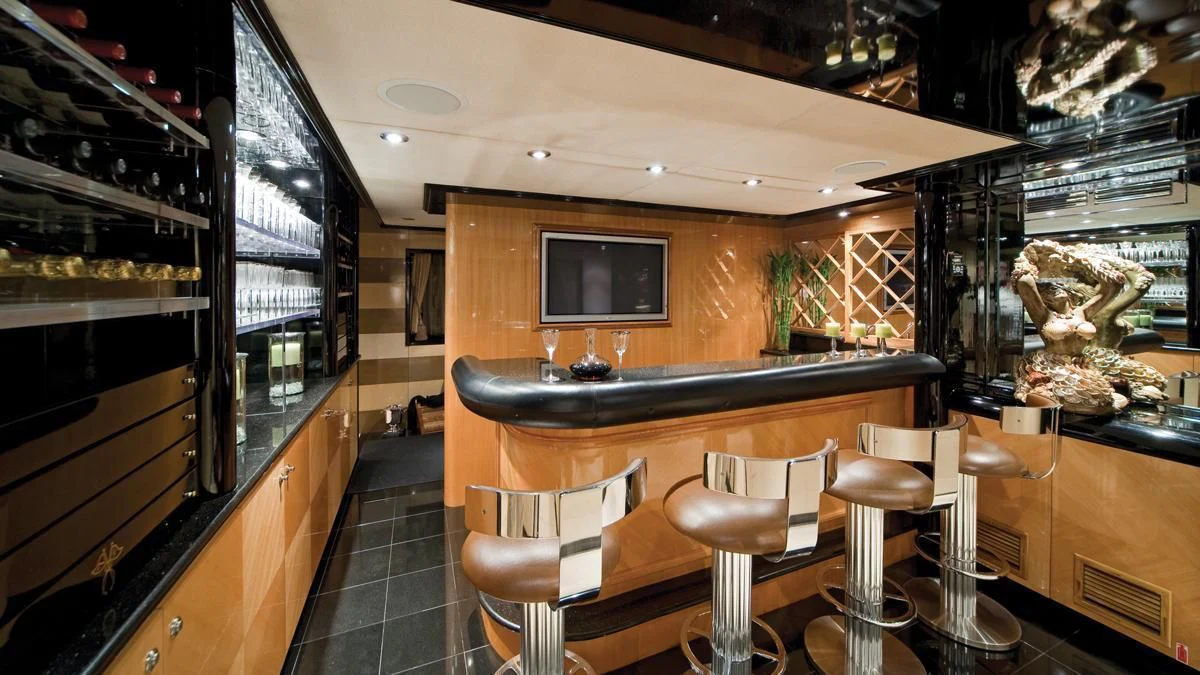 a bar with stools and stools aboard BIG EAGLE Yacht for Sale
