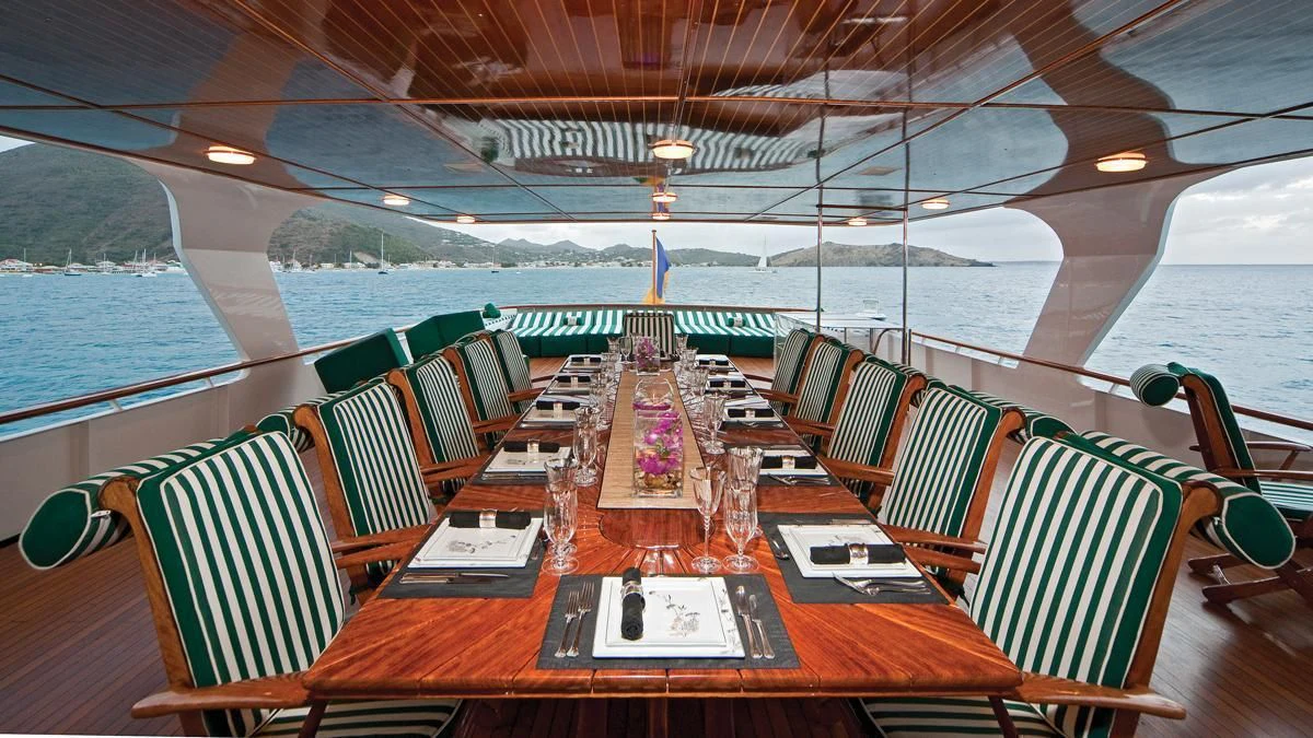 a deck with a view of a beach and water aboard BIG EAGLE Yacht for Sale