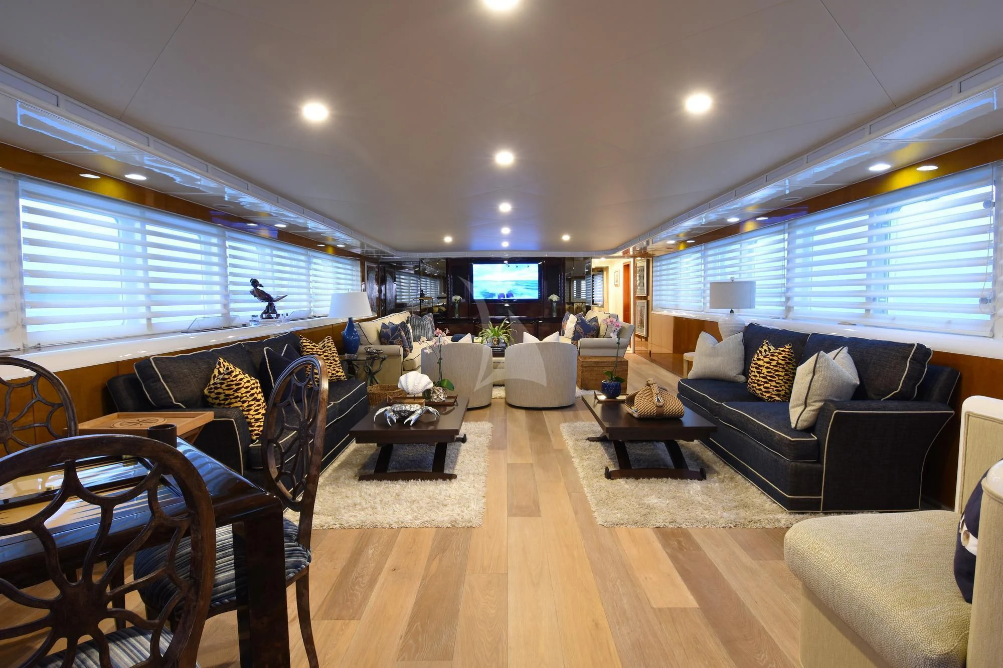 a living room with a wood floor aboard BIG EAGLE Yacht for Sale