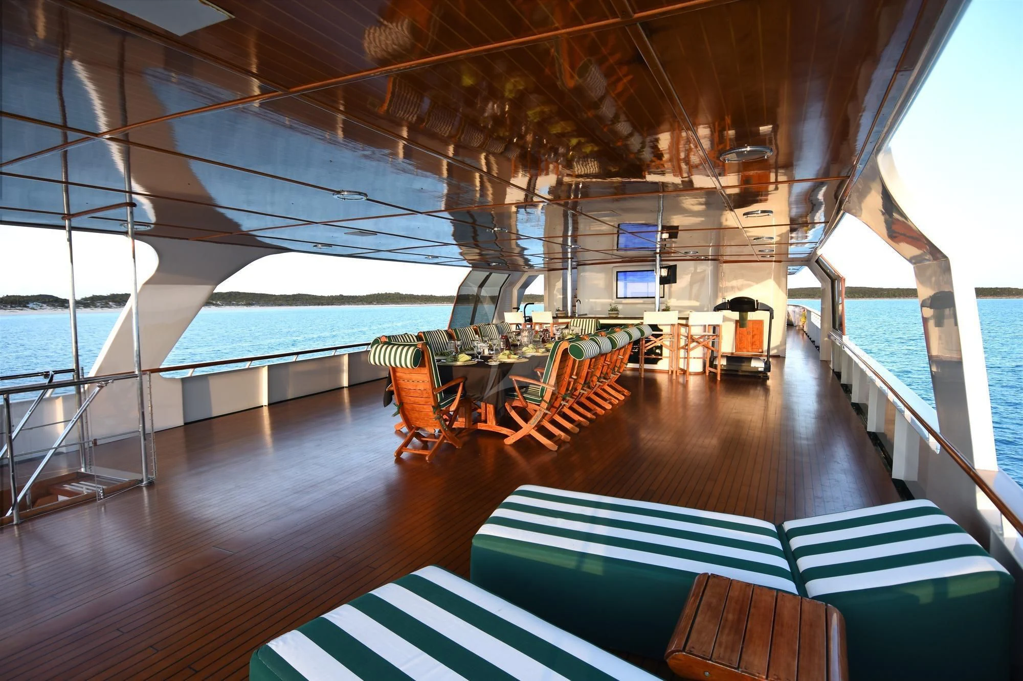 a boat with a table and chairs aboard BIG EAGLE Yacht for Sale