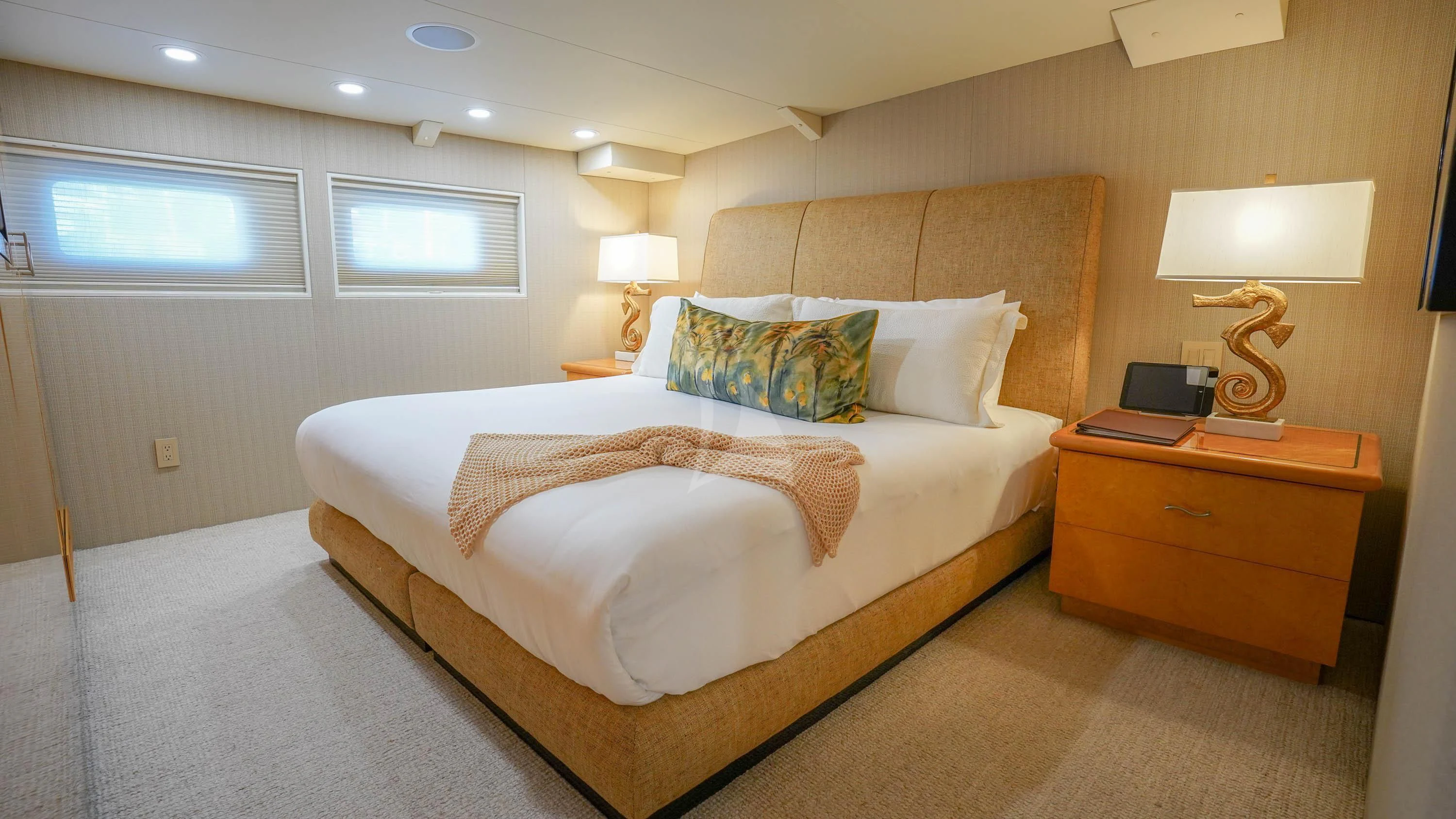 a bedroom with a bed and a desk aboard BIG EAGLE Yacht for Sale