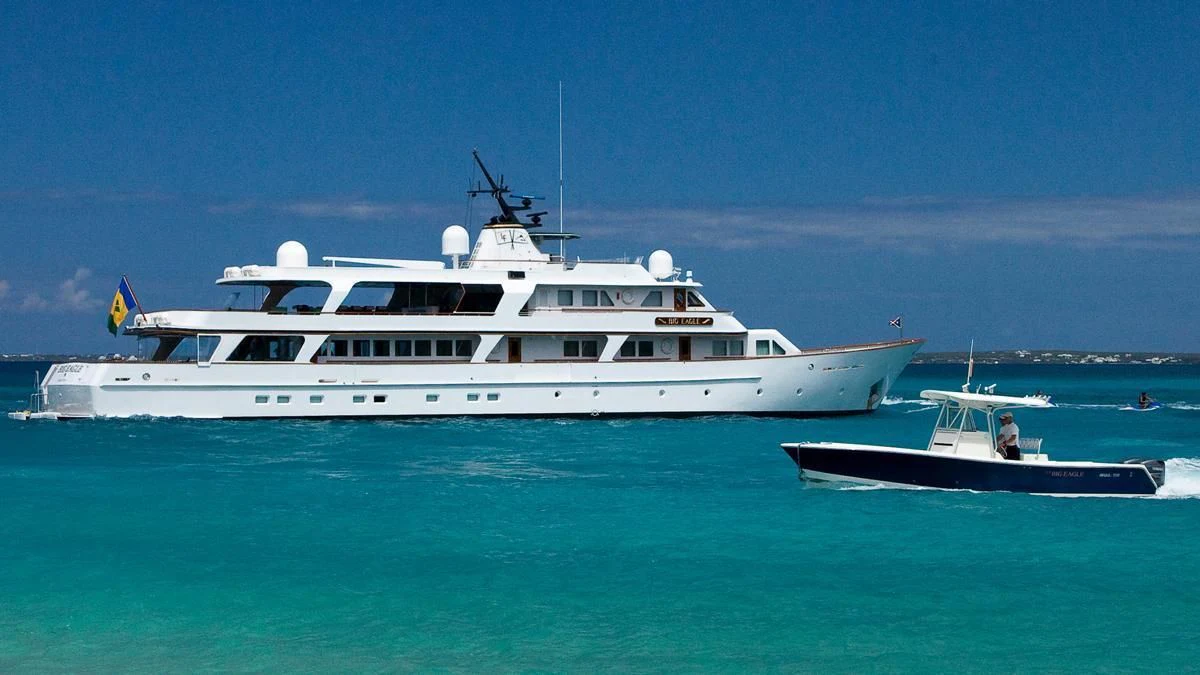 a couple of boats in the ocean aboard BIG EAGLE Yacht for Sale