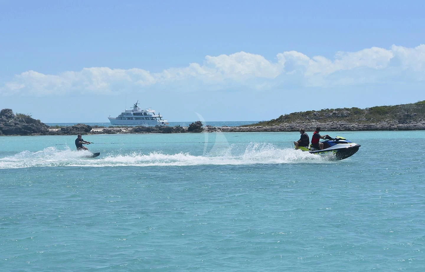 a group of people riding surfboards in the ocean aboard BIG EAGLE Yacht for Sale