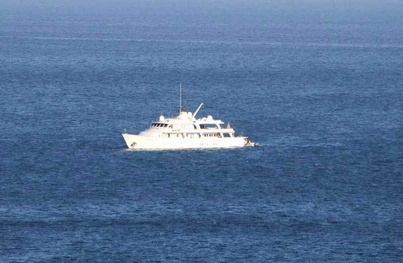 a white boat in the water aboard BIG EAGLE Yacht for Sale