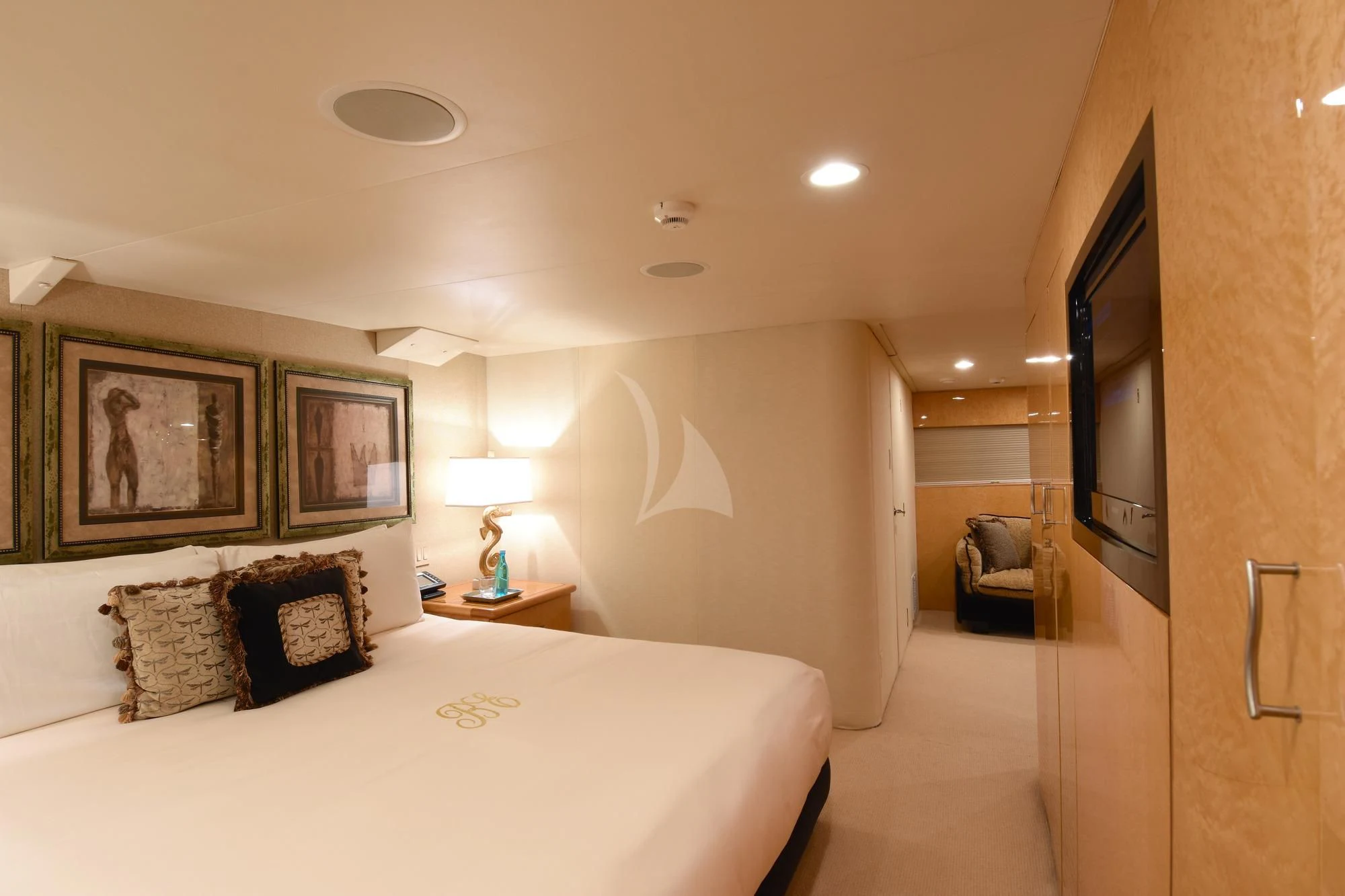 a hotel room with a bed and a mirror aboard BIG EAGLE Yacht for Sale