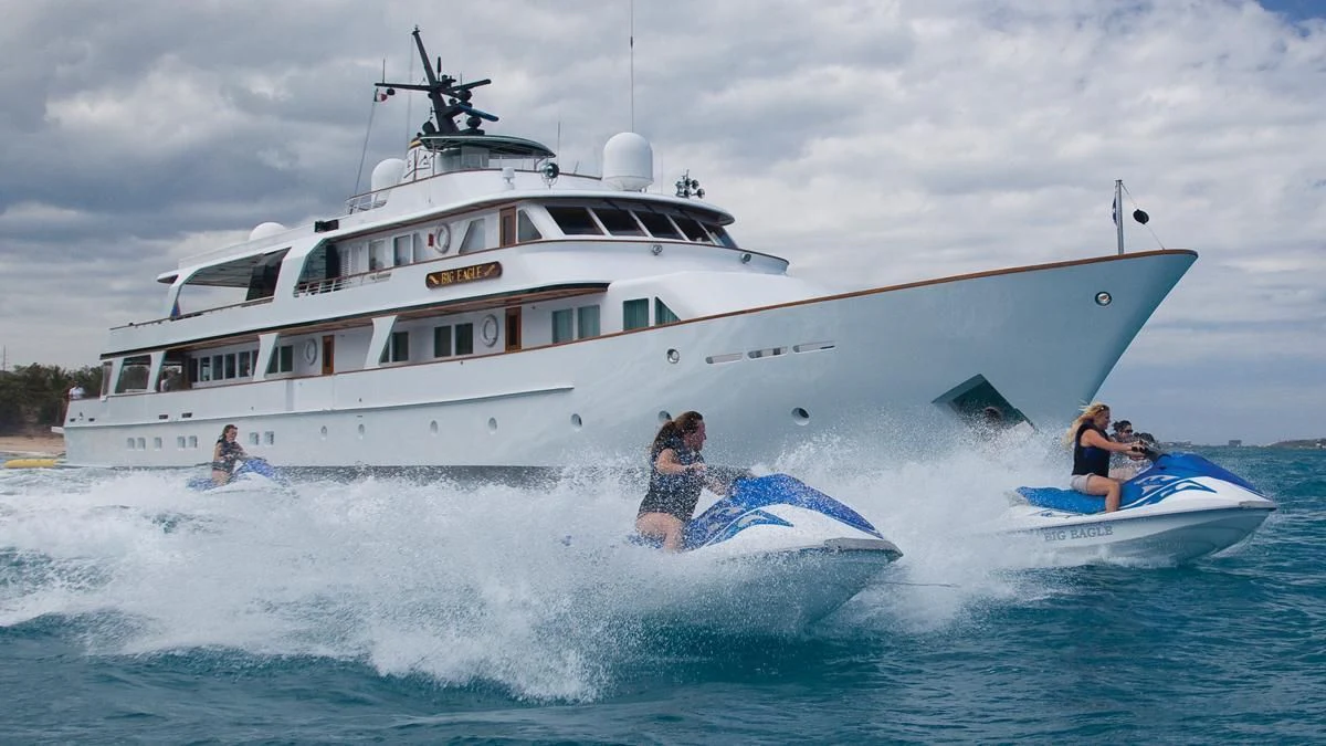 a couple of people on a boat in the water aboard BIG EAGLE Yacht for Sale