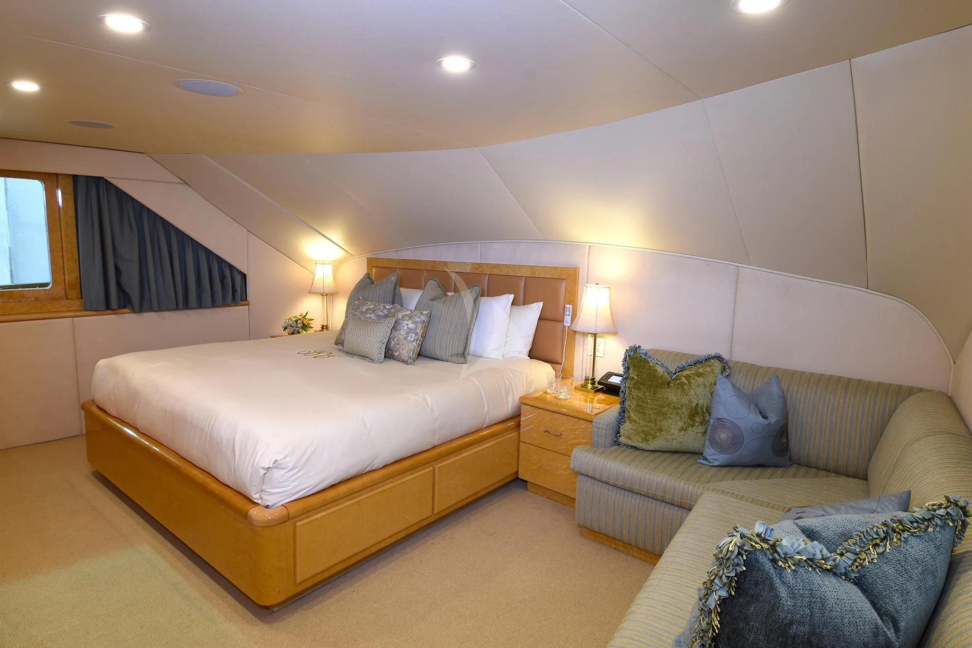 a bedroom with a bed and a couch aboard BIG EAGLE Yacht for Sale