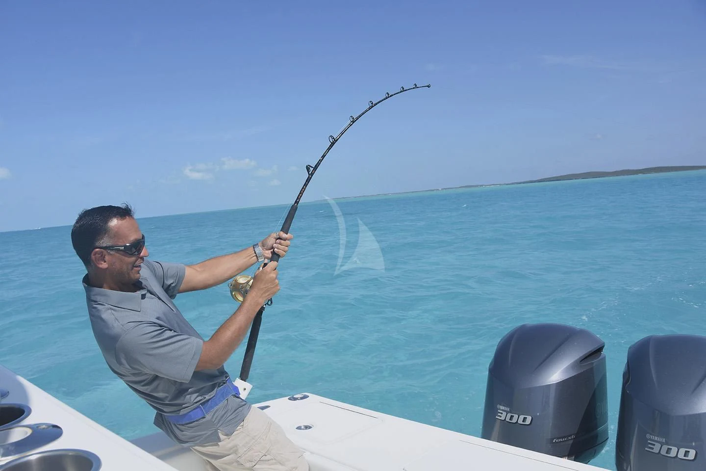 a person fishing on a boat aboard BIG EAGLE Yacht for Sale