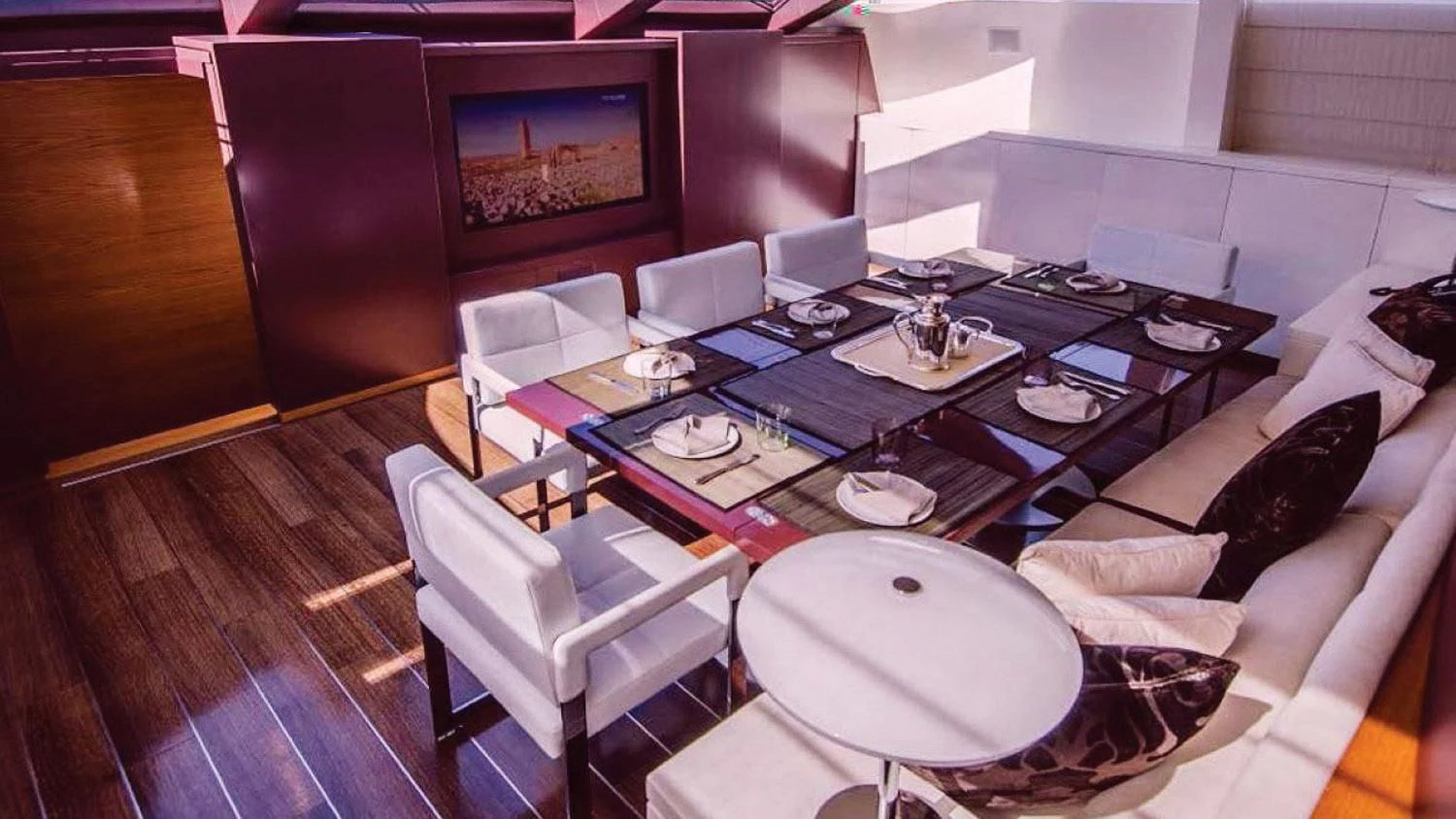 a room with a table and chairs aboard BLUE DEVIL Yacht for Sale