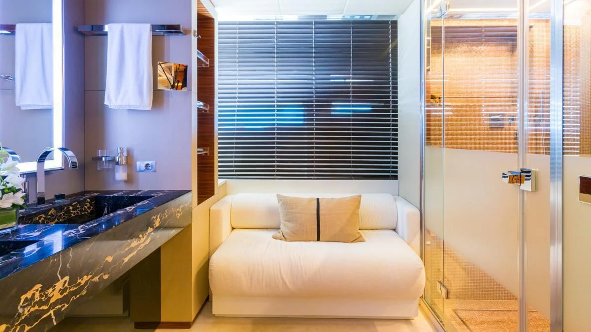 a room with a bed and a sink aboard BLUE DEVIL Yacht for Sale
