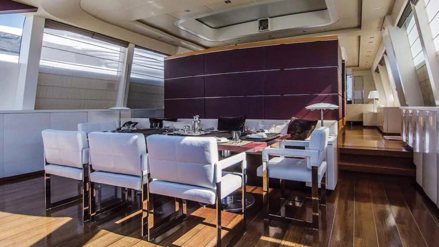 a room with a table and chairs aboard BLUE DEVIL Yacht for Sale