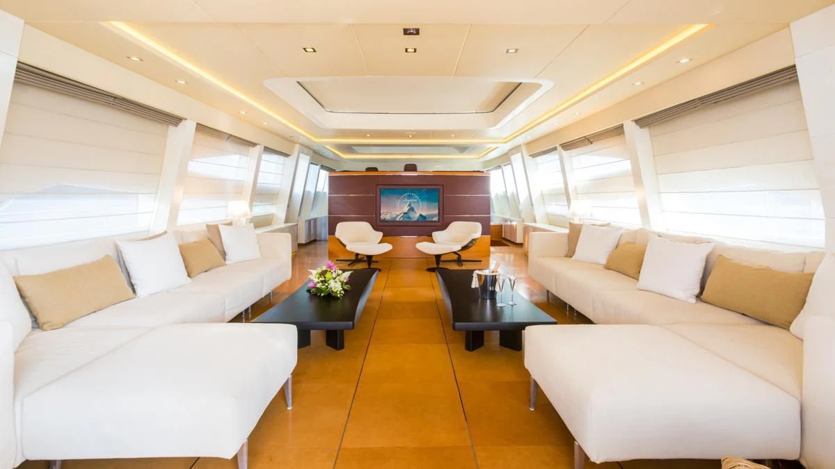 a living room with white couches aboard BLUE DEVIL Yacht for Sale