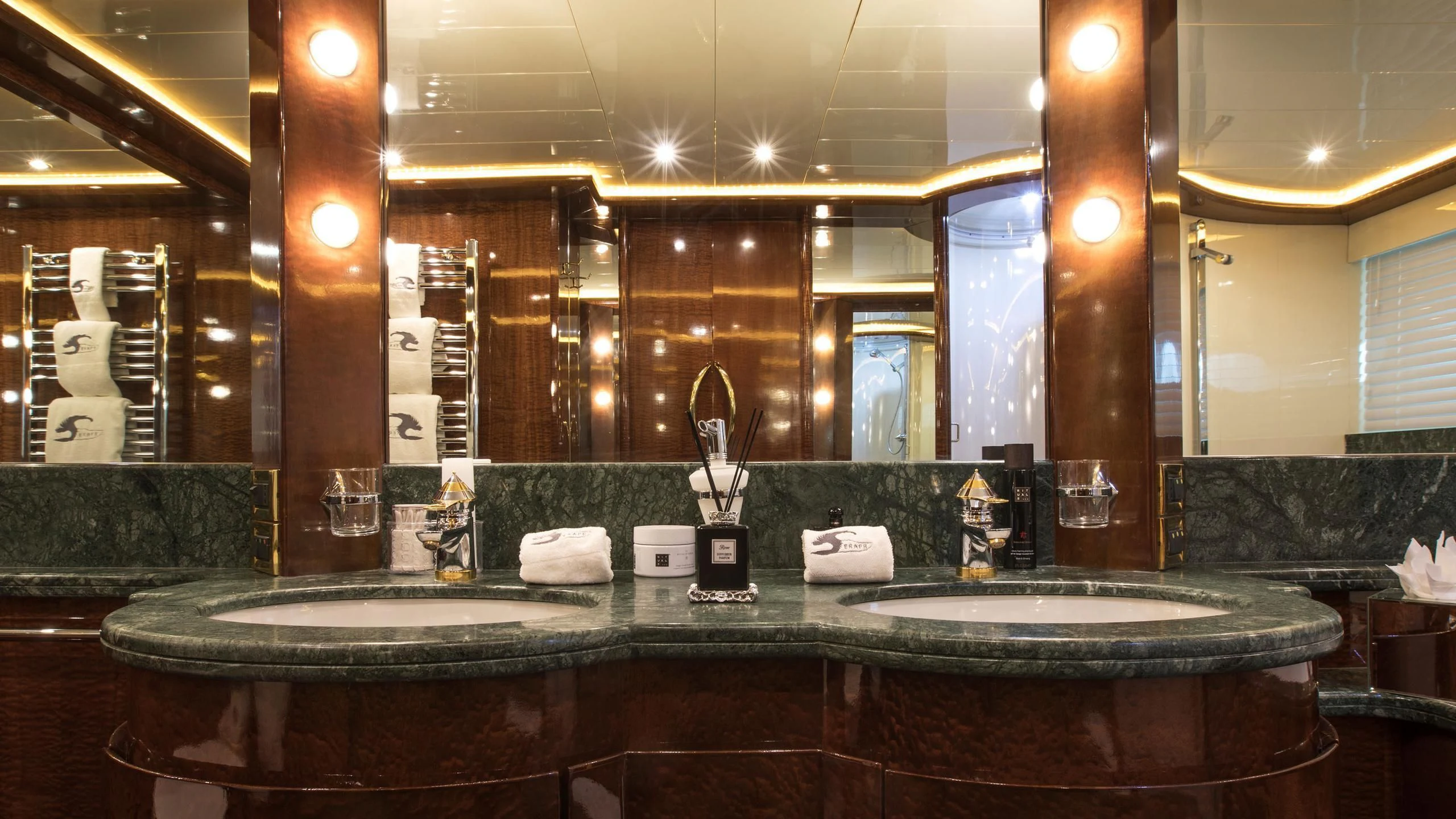 a bathroom with a large mirror aboard SERAPH PRIMERO Yacht for Sale
