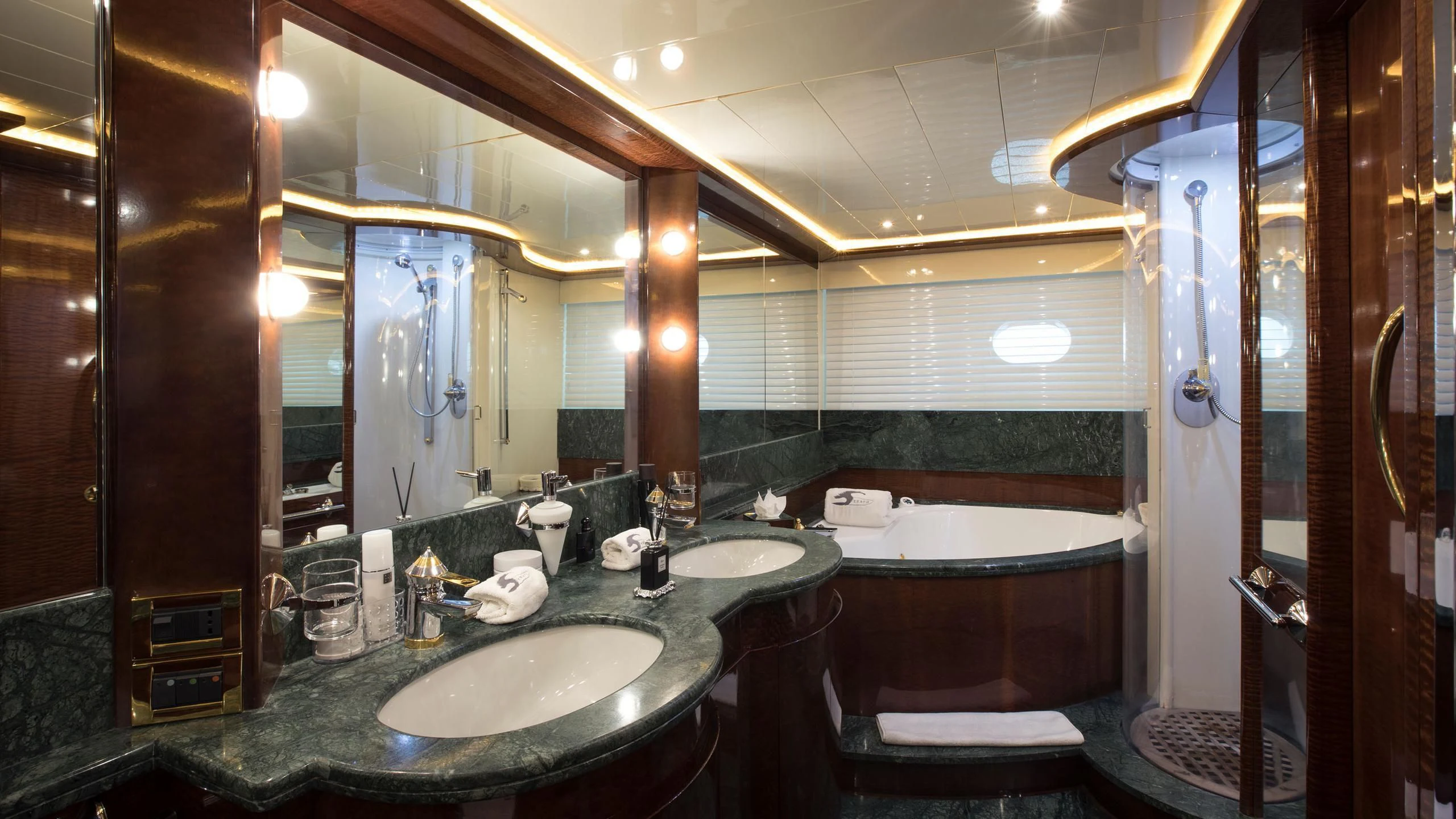 a bathroom with a large mirror aboard SERAPH PRIMERO Yacht for Sale