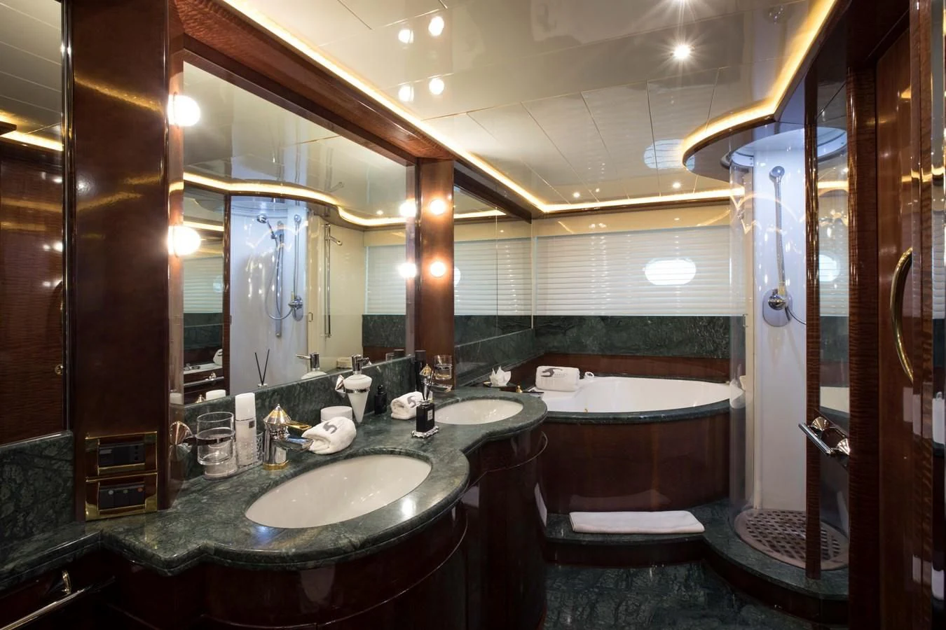 a bathroom with a large mirror aboard SERAPH PRIMERO Yacht for Sale