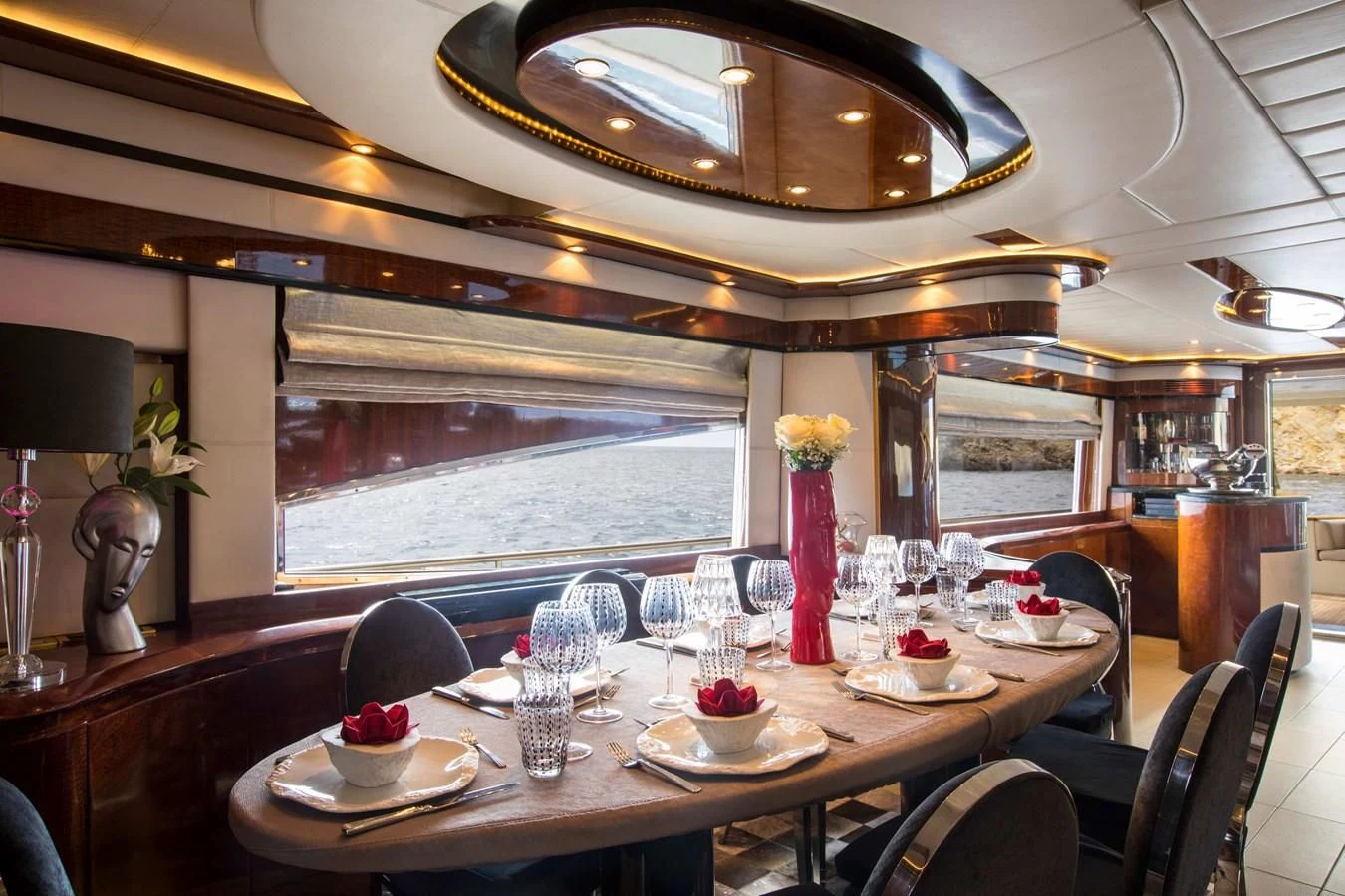 a dining room with a table set aboard SERAPH PRIMERO Yacht for Sale