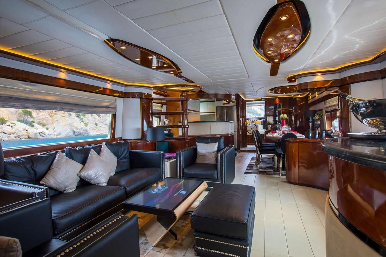 a room with a couch and a table aboard SERAPH PRIMERO Yacht for Sale