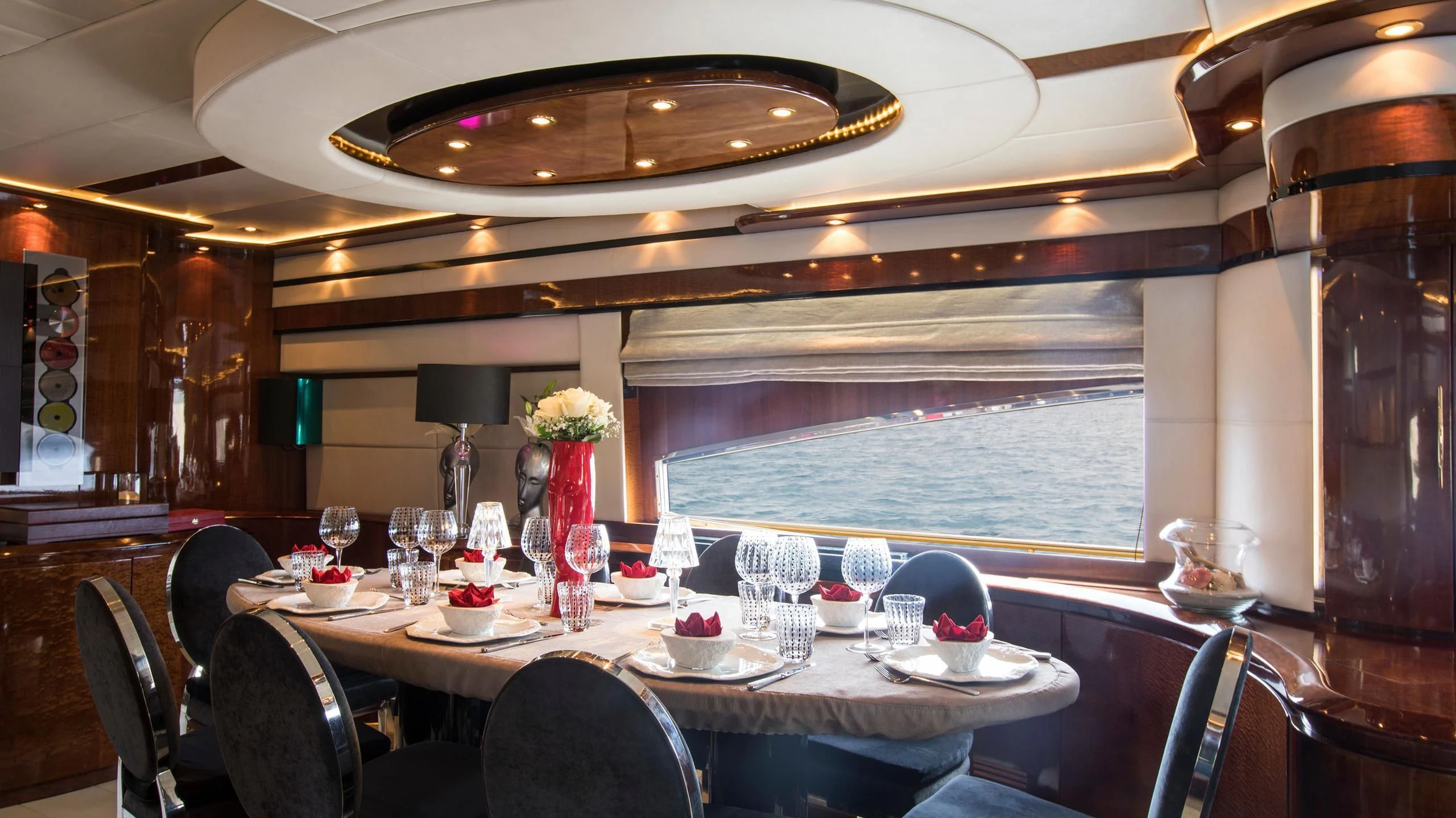 a dining room with a table set for a meal aboard SERAPH PRIMERO Yacht for Sale